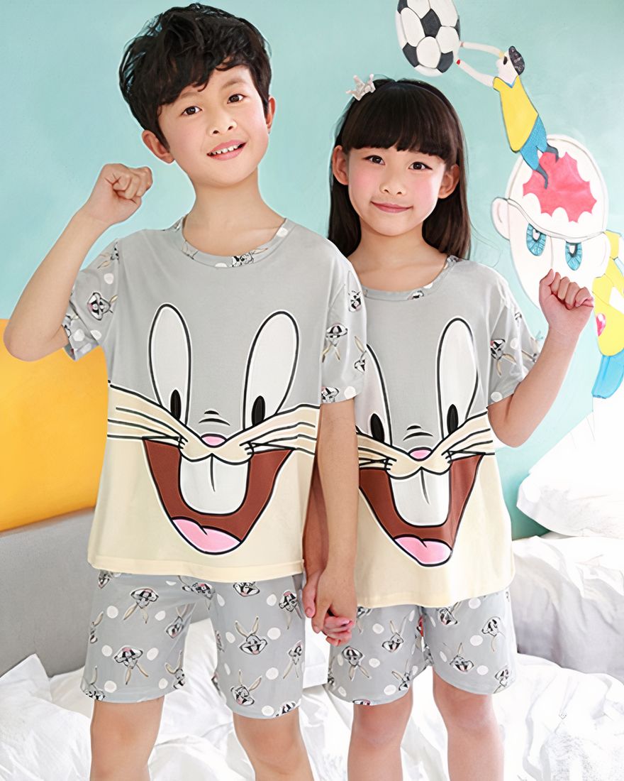 Grey short sleeve summer pajamas with Bugs Bunny pattern for kids worn by kids inside a house