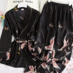 Japanese black satin pajamas composed of two pieces, one piece is a black top and the second piece is a black satin sarouel