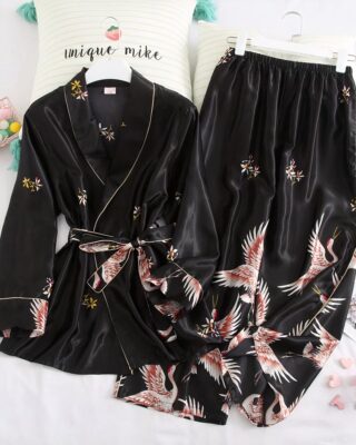 Japanese black satin pajamas composed of two pieces, one piece is a black top and the second piece is a black satin sarouel