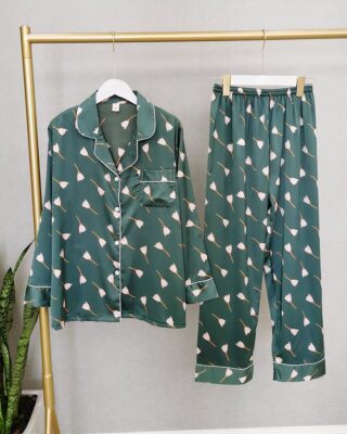 Pyjamas fall long sleeves with white flower pattern on a hanger in a house