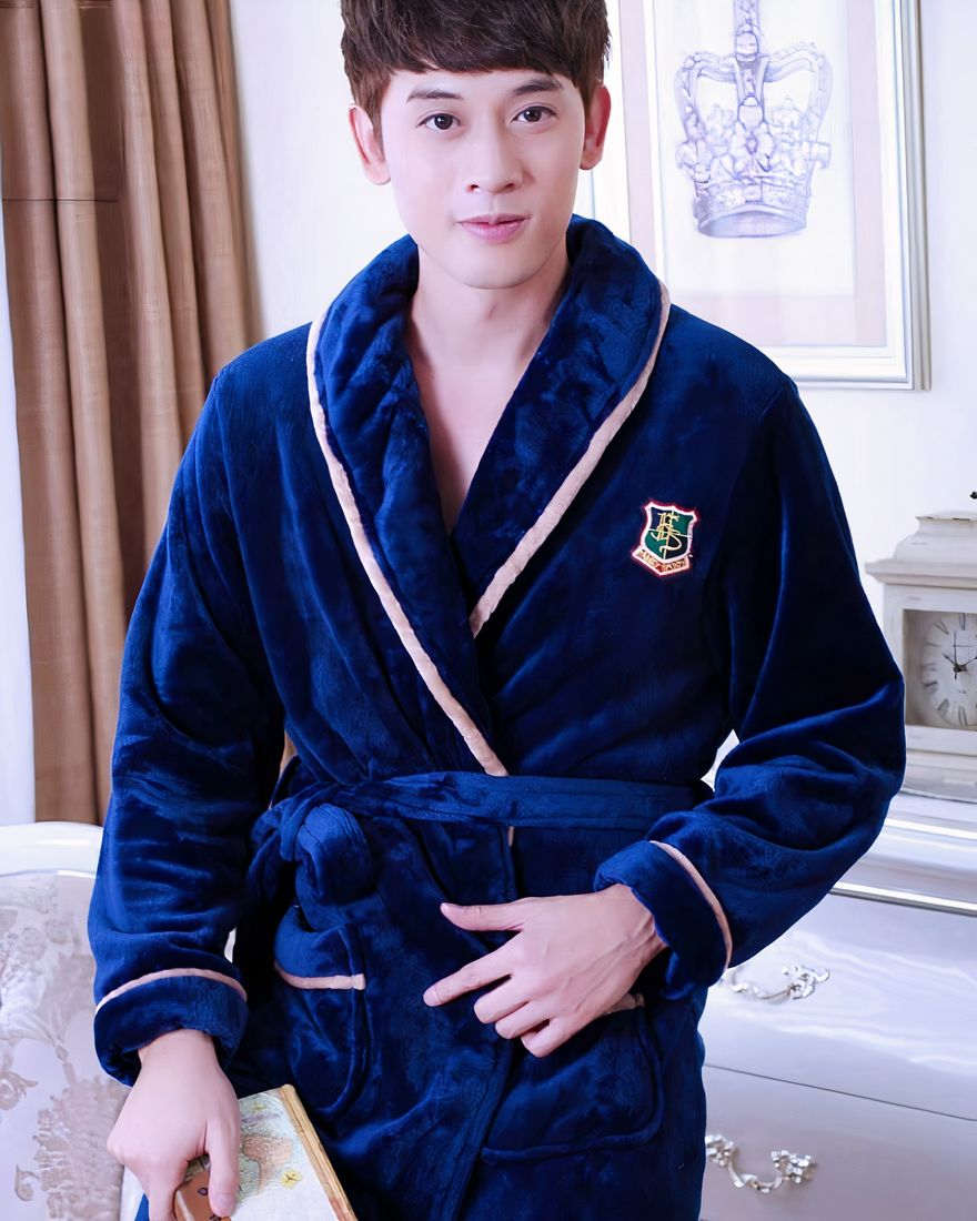 Men's navy blue flannel kimono pajamas worn by a man in a house