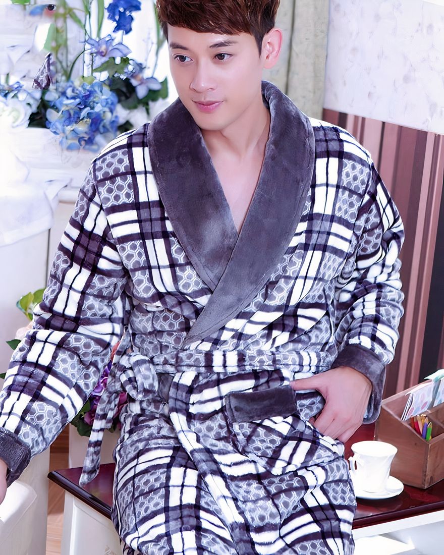 Men's flannel plaid pajamas robe worn by a man in a house