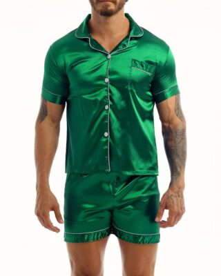 Green satin pajamas worn by a man tattooed on his left arm, the pajamas are composed of shorts and a shirt with buttons on the front