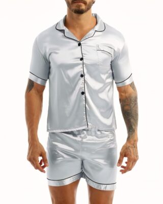 Gray satin pajamas worn by a man tattooed on his left arm, the pajamas are composed of shorts and a shirt with buttons on the front