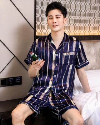 Short sleeve luxury pajamas with folded collar for men with a man wearing the pajamas with a background a room