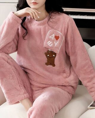 Polar pyjamas for woman with bear pattern very comfortable worn by a woman in a house