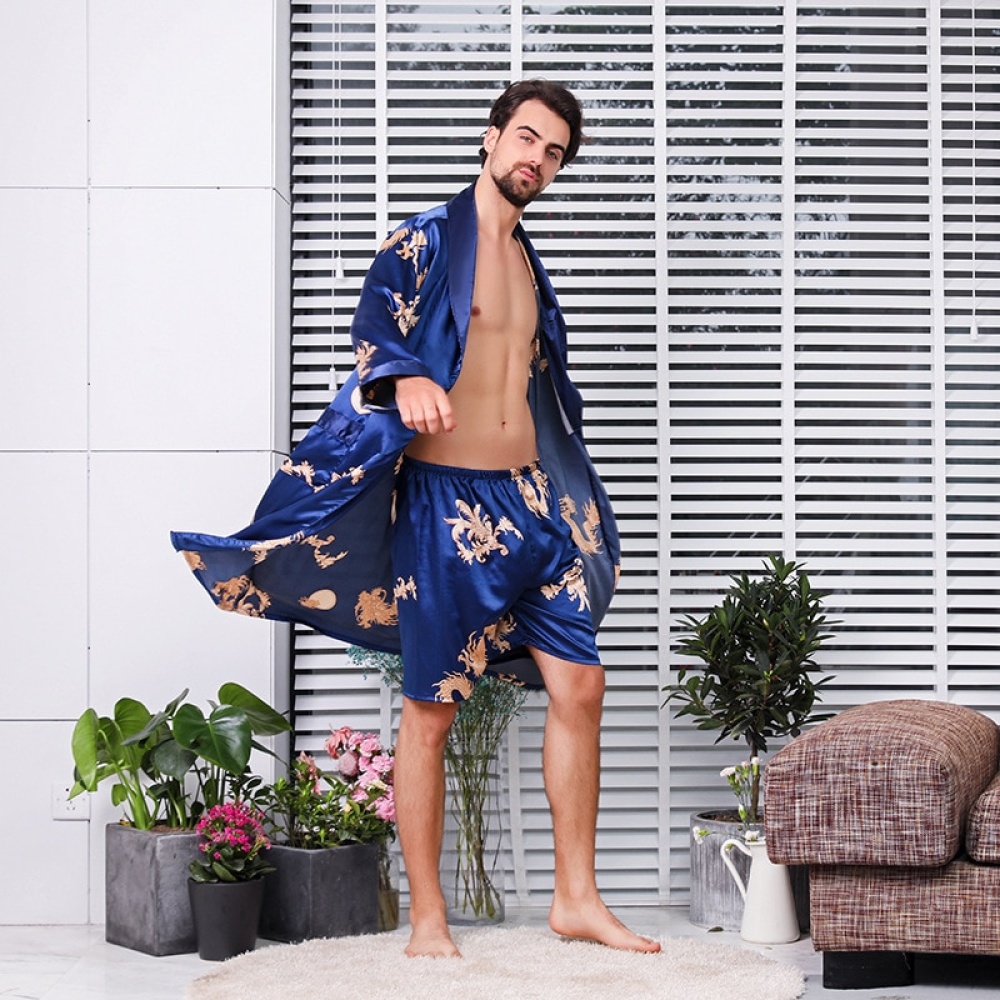 Two-piece satin kimono pajamas with dragon print worn by a fashionable man