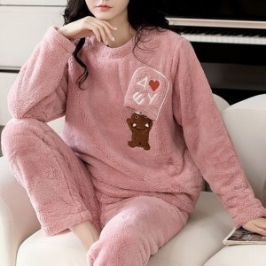 Polar pyjamas for woman with bear pattern very comfortable worn by a woman in a house