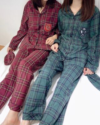 Harry Potter pajama set with green and red checks with two women wearing the pajamas in bed