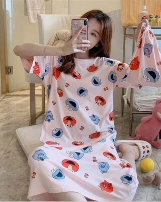 Short sleeve nightgown with Elmo print worn by a woman in a house