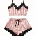 Sexy pink nightwear set with black lace details with white background