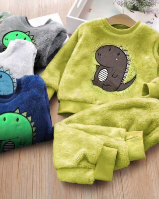 Pyjamas dino very soft in several colors in a wooden background