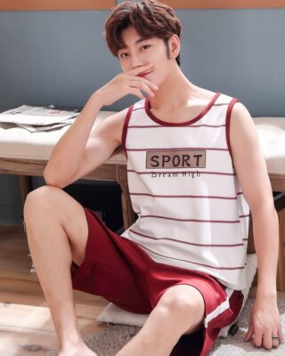 White striped red sleeveless summer pajamas and red shorts for men worn by a woman sitting on a carpet