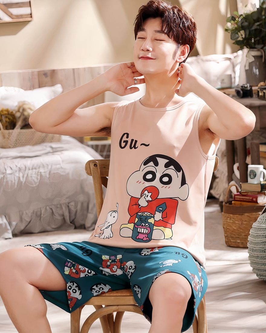 Summer pajamas cotton sleeveless cartoon pattern for man worn by a man sitting on a chair in a house
