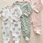 3-piece pyjama suit with tree and flower design for baby with beige background