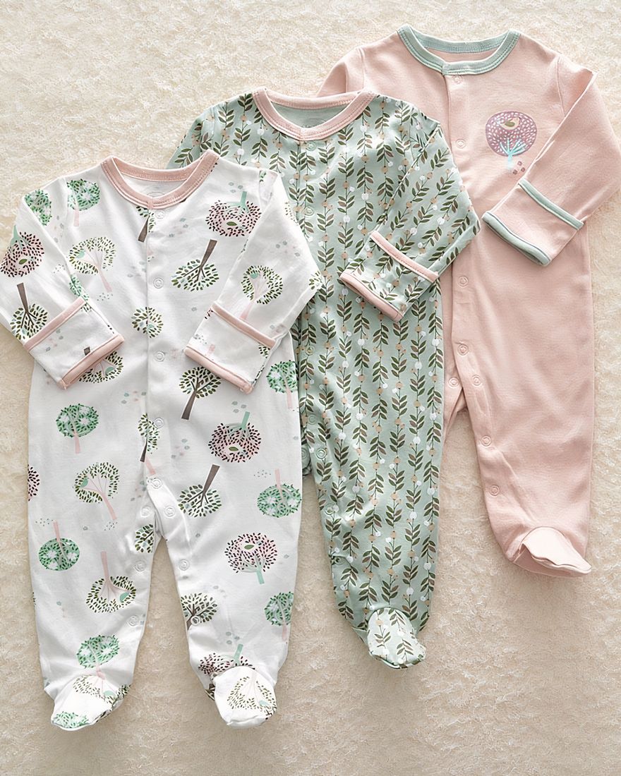 3-piece pyjama suit with tree and flower design for baby with beige background
