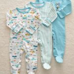3-piece pyjama suit with car motif for little boy with beige background