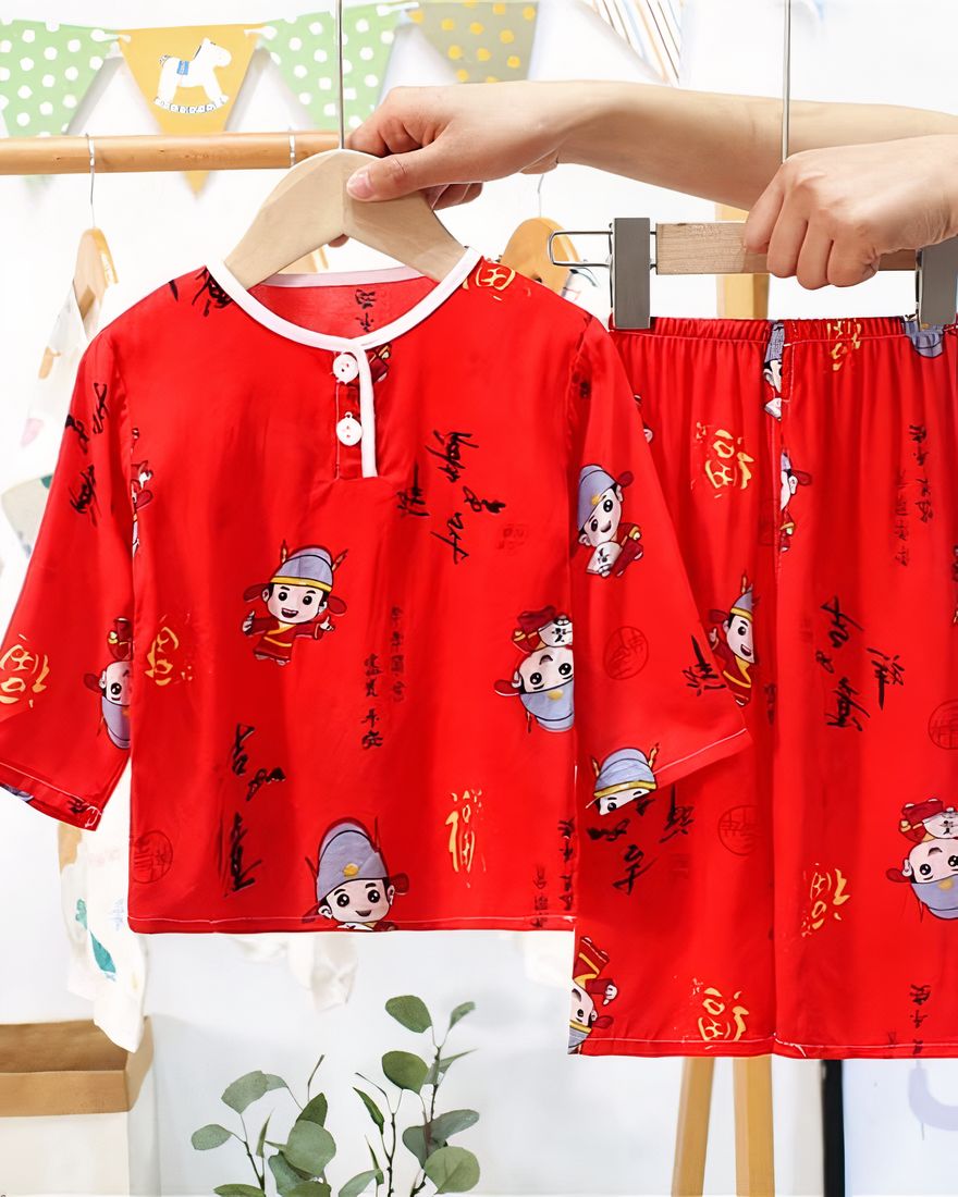 Red two-piece pyjama with half-length sleeves for child with pattern on a belt