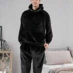 Black pyjamas for men with hood, it is worn by a tall and young man