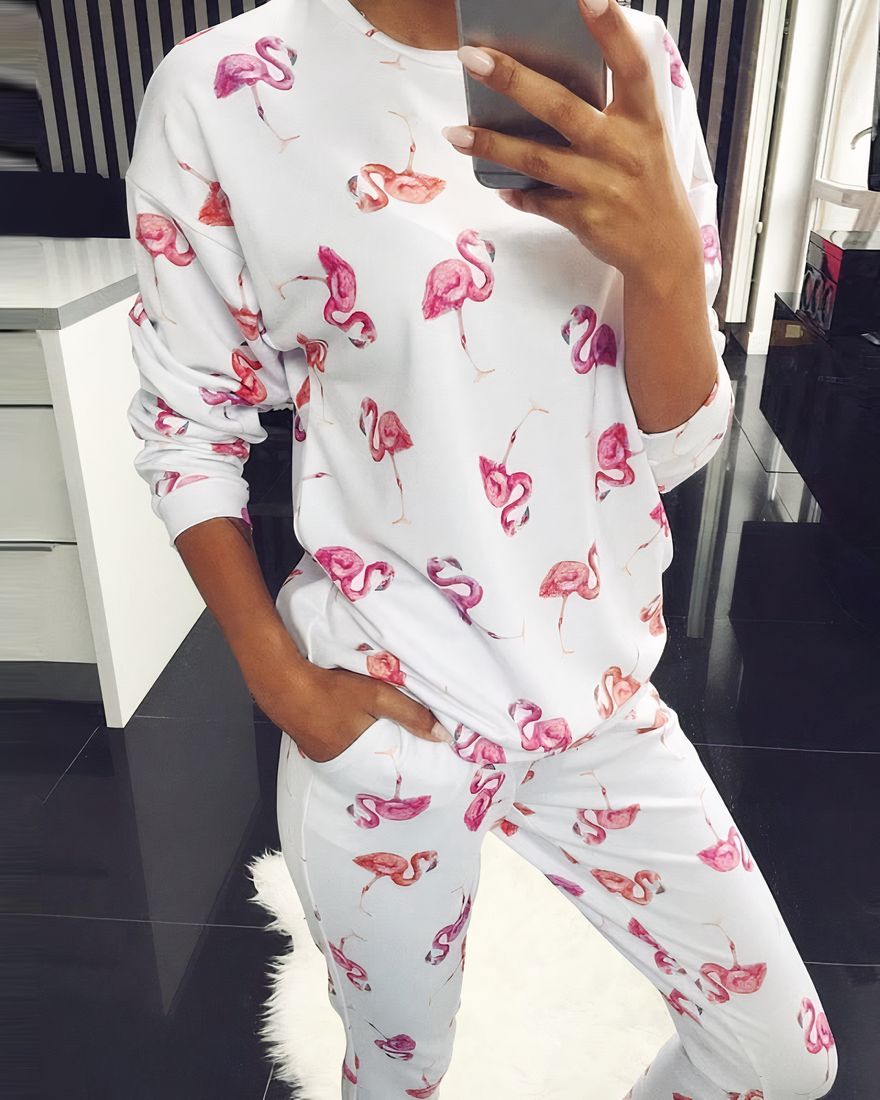 Warm pajamas with exotic white and pink pattern with a woman wearing the pajamas