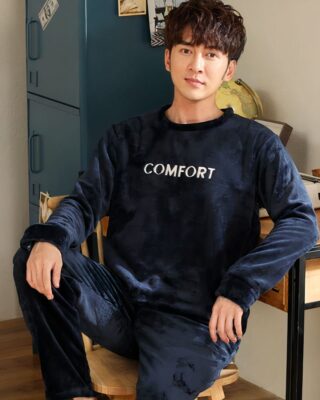 Black two-piece winter pajamas for men. it is worn by a man