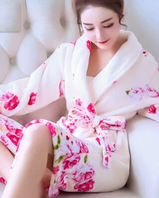 Coral fleece nightgown with a very high quality floral pattern worn by a woman sitting on a chair