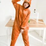 Women's brown bear pajama suit with a desktop background