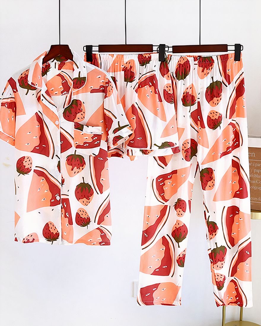 Women's three-piece pajamas with melons and strawberries hanging on a white background