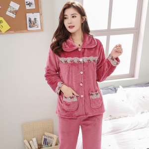 Women's warm fleece pajama set worn by a woman in a house