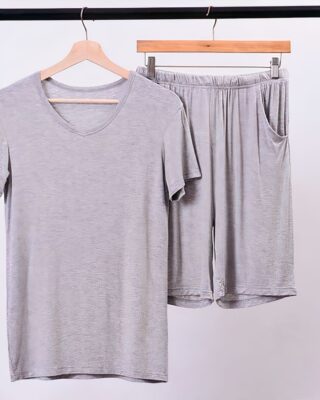 Pyjashort for man in grey color hanging on a wooden hanger