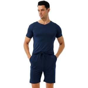 Blue pyjashort worn by a brown man with his hands in his pockets