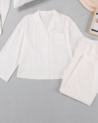 Women's white cotton summer pajamas on a grey ground